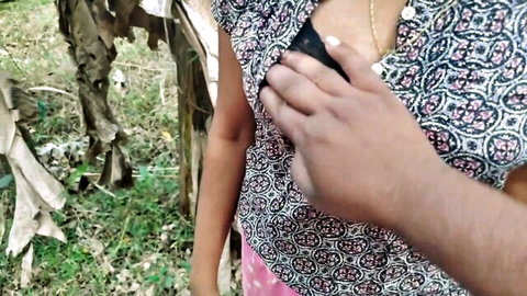 Gauri21 teases outdoors with hand near exposed breast in wild adventure