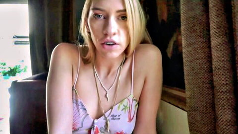 Blonde stepdaughter in floral camisole top, seductive gaze for stepdad fantasy