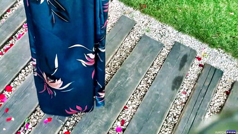 Throat GOAT in elegant blue floral dress on garden path POV tease