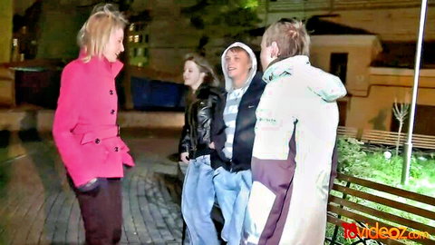 Group of clothed young adults in outdoor night challenge scene