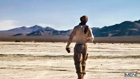Shirtless muscular Malik Delgaty walks in desert pants, outdoor gay tease