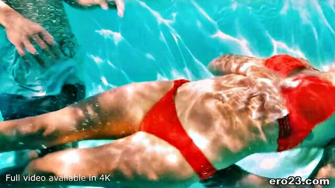 Chanel Grey in red bikini floating in pool, outdoor adult tease with Tyler Nixon