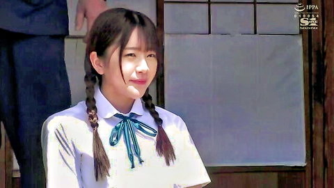 Cute Japanese schoolgirl in tight uniform with pigtails, smiling naughtily