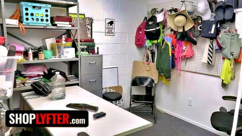 Cluttered store backroom with shelves, colorful bags, hats, desk and chairs in ShopLyfter video