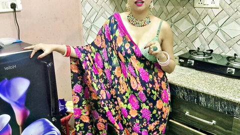 Seductive Indian woman in colorful saree with deep cleavage pose