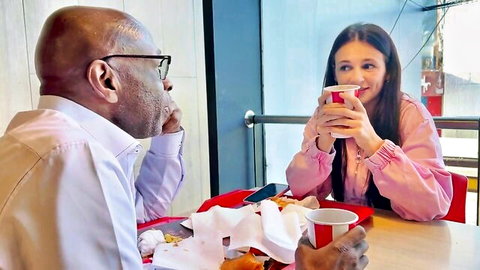 Kate Rich chats intimately with a mature Black man over fast food