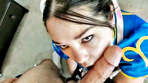 Asian woman in Chun Li cosplay kneels for POV blowjob