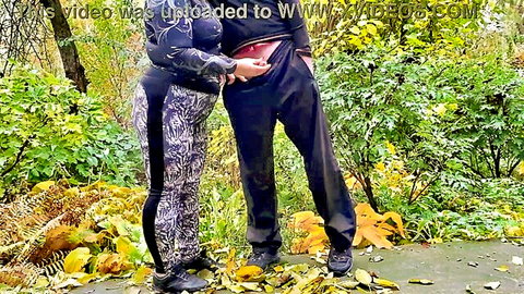 Curvy stepmom teases stepson outdoors with hand on bulge