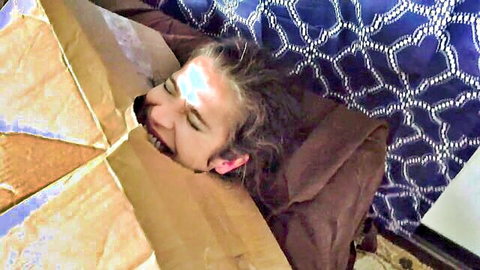 Sammi Starfish as oblivious stepmom peeking from costume box, playful smile