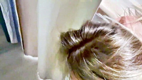 Monika Fox with messy blonde bun in white lingerie post-sex glow