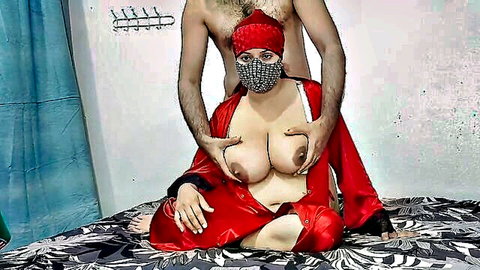 Masked Indian MILF's huge natural tits groped by shirtless man from behind in open red robe