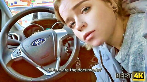Blonde teen in Ford car looking sad while asking for documents