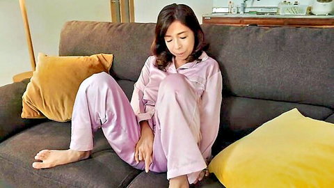 Sumie Hirota mature Japanese MILF in pink pajamas, seductive seated pose