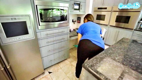 Curvy Latina maid bends over in tight black pants showing huge PAWG ass while cleaning kitchen on CamSoda webcam