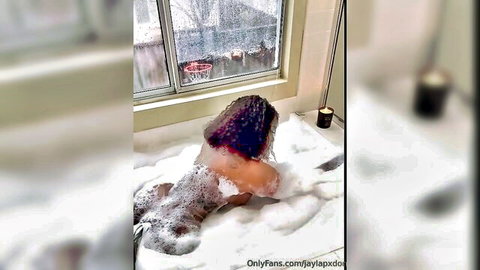 Ebony babe in bubbly bathtub showing juicy wet ass cheeks from behind