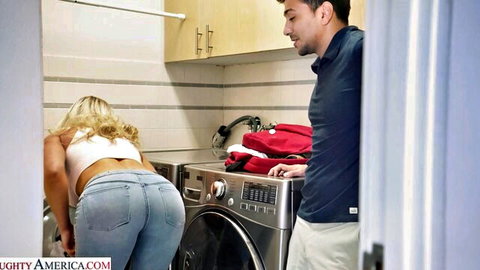 Blonde bombshell bends over washing machine showing huge ass in tight jeans to horny guy