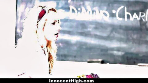 Blonde schoolgirl with red headband facing chalkboard in classroom on InnocentHigh.com