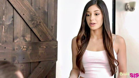 Surprised brunette stepsister in tight pink tank top standing by barn door