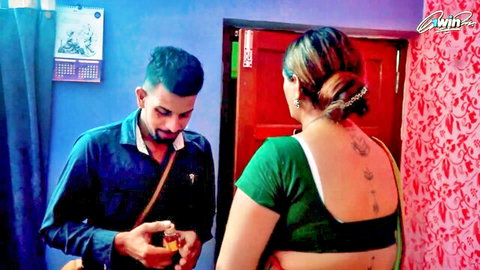 Bhargavi in backless green saree blouse showing tattoo, AnujK holds oil bottle