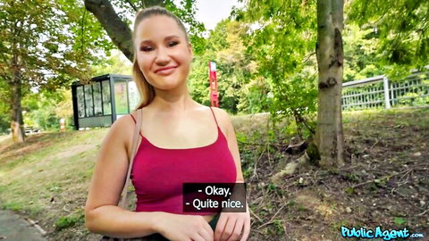Amalia Davis smiles in pink tank top outdoors, teasing big tits in public