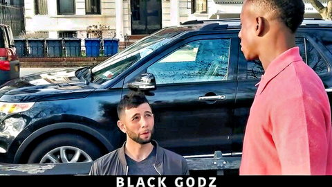 Tall black stud in pink shirt seduces bearded guy by black SUV in gay teaser