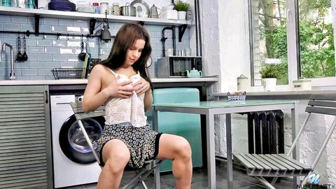 Skinny brunette with big tits pulls open sheer lace top exposing nipples in kitchen striptease