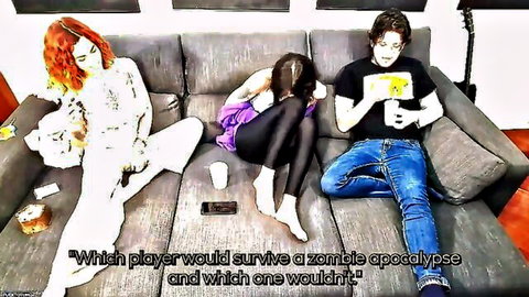 Skinny redhead and brunette in tight clothes tease guy on couch during naughty zombie game