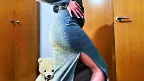 Curvy babe in tight shiny green skirt teasing juicy ass cheeks and thighs with teddy bear peeking