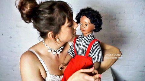 Janey Jones in lingerie kissing black male doll intimately