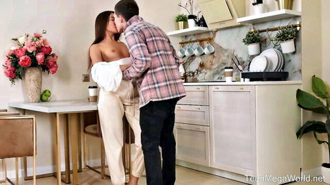 Topless brunette girlfriend passionately kissing boyfriend in intimate embrace