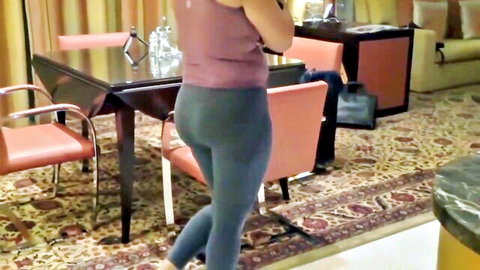 Curvy South Asian cougar in tight gray leggings flaunts huge round ass in luxury hotel room
