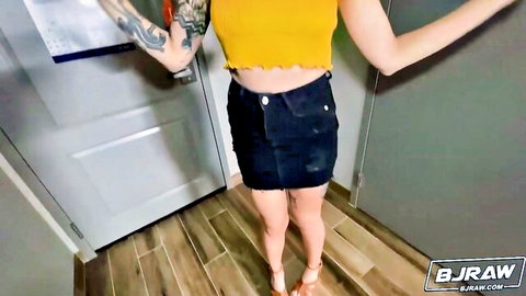 Petite tattooed blonde babe in yellow crop top and black mini skirt posing teasingly