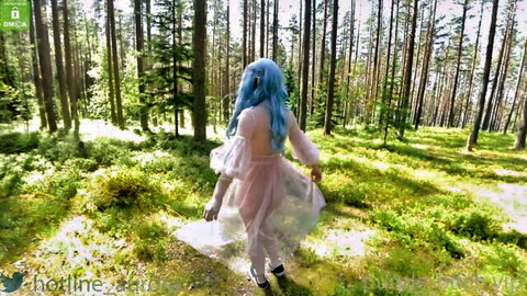 Blue-haired elven girl in sheer flowing dress walking in sunny forest