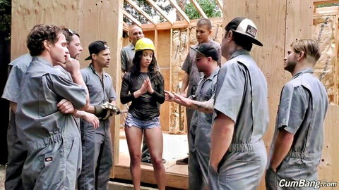 Latina in hard hat surrounded by construction workers for gangbang