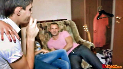 Three young adults embracing casually on couch in teasing teen group preview