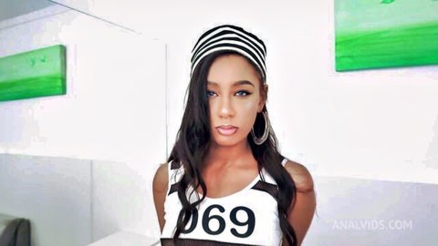 Brazilian beauty Bianca Dantas in striped headband and sexy numbered top pose
