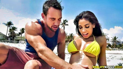 Gia Milana in yellow bikini gets oiled by Johnny Castle on beach