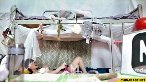 Naughty Asian dorm girl exposes perky tits and spreads legs in pink panties on bunk bed
