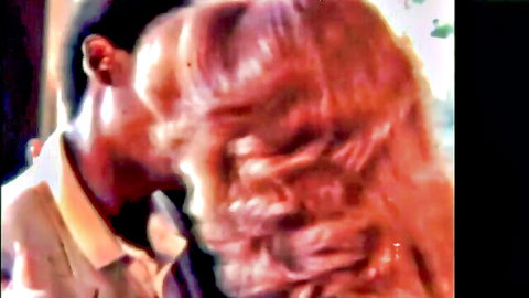 Ebony man passionately kissing blonde woman's lips in steamy interracial closeup