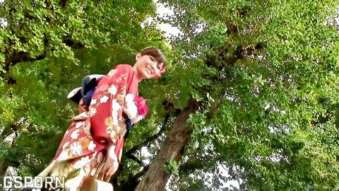 Petite Japanese teen babe flashing small perky tits from open red kimono outdoors
