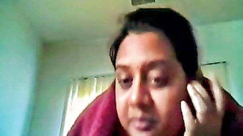 South Asian babe in red towel touching ear in amateur webcam closeup