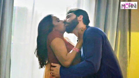 Indian babe passionately kissing bearded man embracing her waist