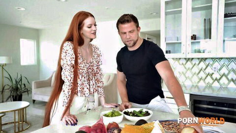 Sexy redhead with long hair and stud preparing veggies in kitchen Porn World tease
