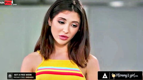 Jane Wilde in seductive yellow striped tank top, teasing gaze