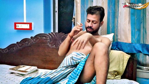 Shirtless Indian man lounging on bed, teasing desi housewife anal fantasy