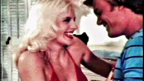 Blonde Joanna Storm smiling intimately with Blake Palmer in red top close-up
