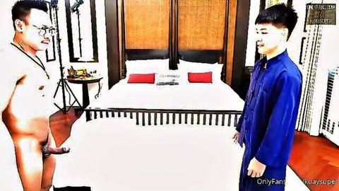 Naked Asian stud with huge erect cock stands facing clothed boyfriend in blue traditional outfit by bed
