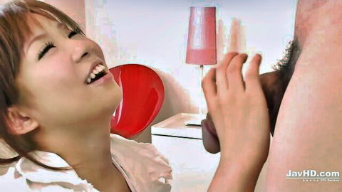 Smiling Japanese girl with long hair gripping thick black cock eagerly