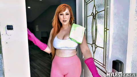 Curvy redhead MILF in tight pink leggings and white bra showing huge tits at door