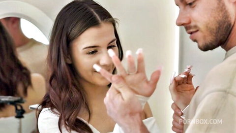 Baby Doll brunette showing white cum on fingers after blowjob tease